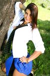 Long Haired Brunette Lays Off Her School Uniform And Shows Her Big Tits By The Tree photos (Emma T)