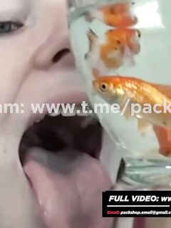 Beautiful white woman devours her fish alive - vore